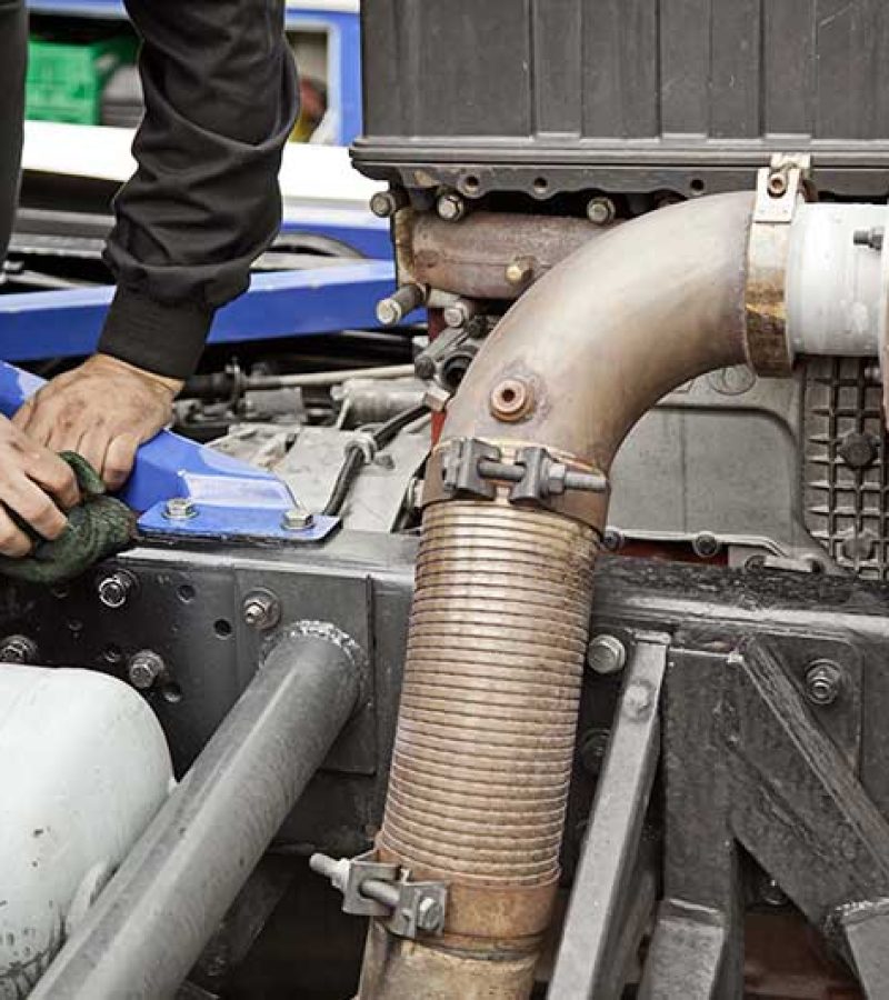 Truck Mechanic, detail of a professional mechanic, engine repair